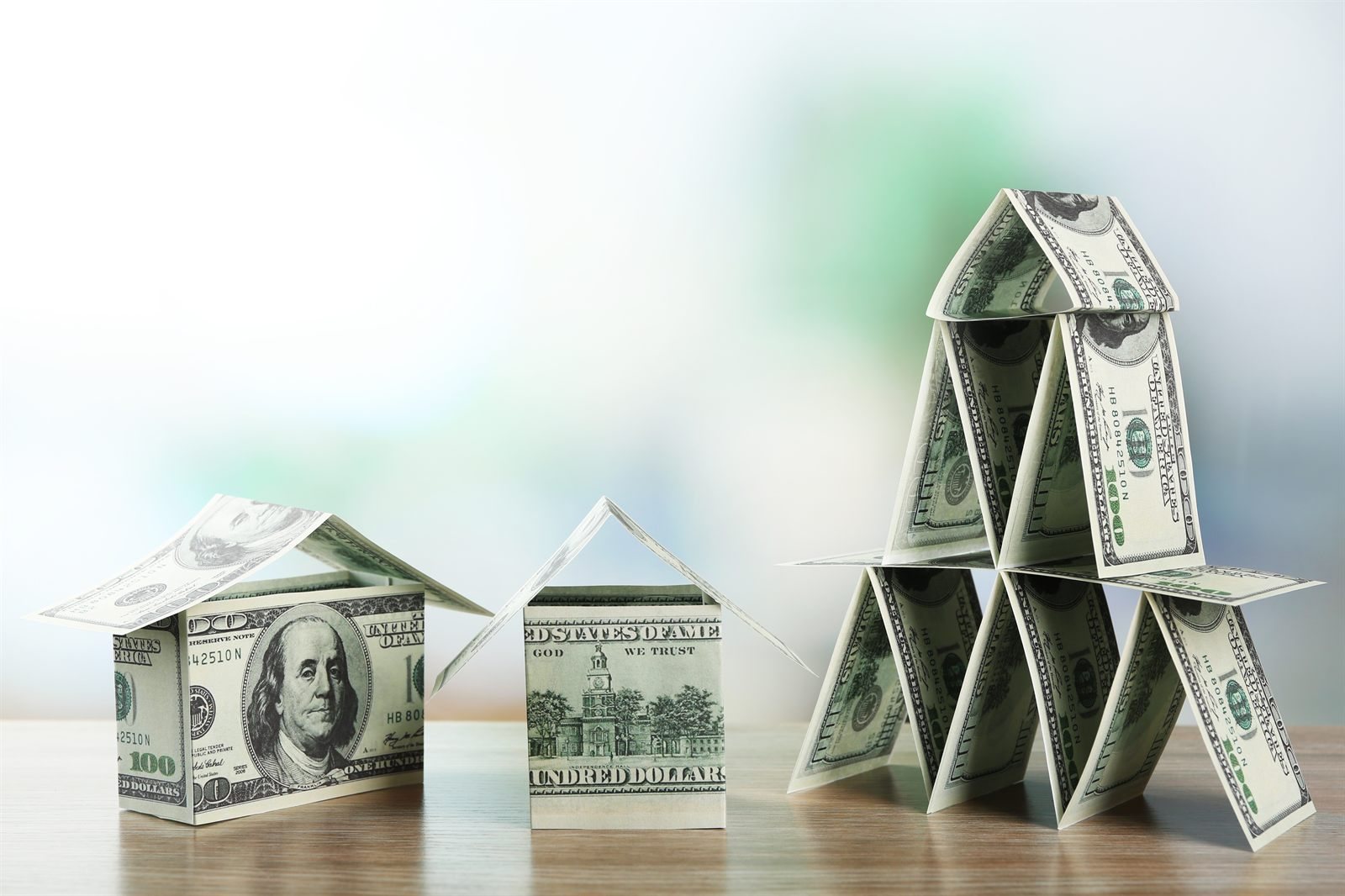 House built from banknotes representing loan pricing