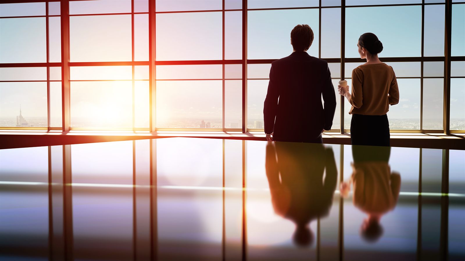 Two business colleagues talking in a modern office