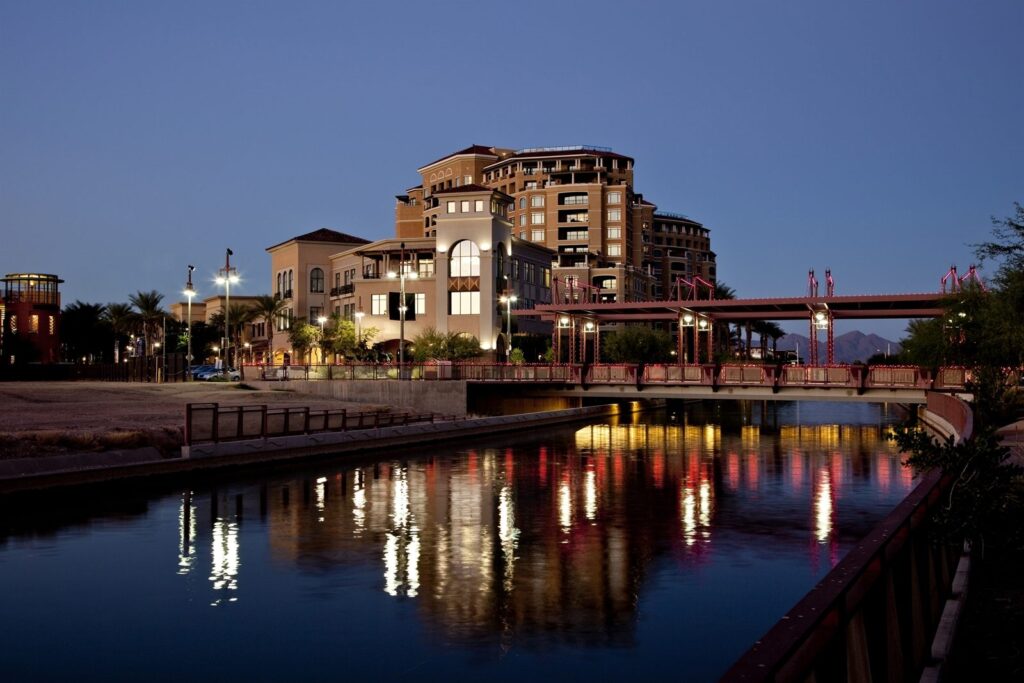 A canal district with buildings reflected at dusk