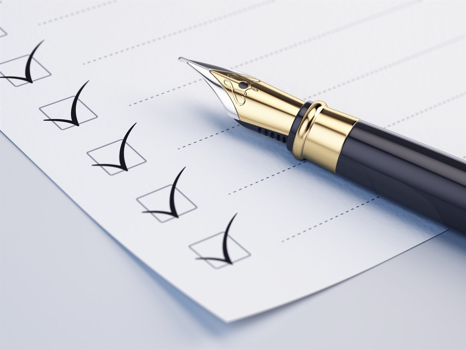 A checklist with ticked boxes and a fountain pen