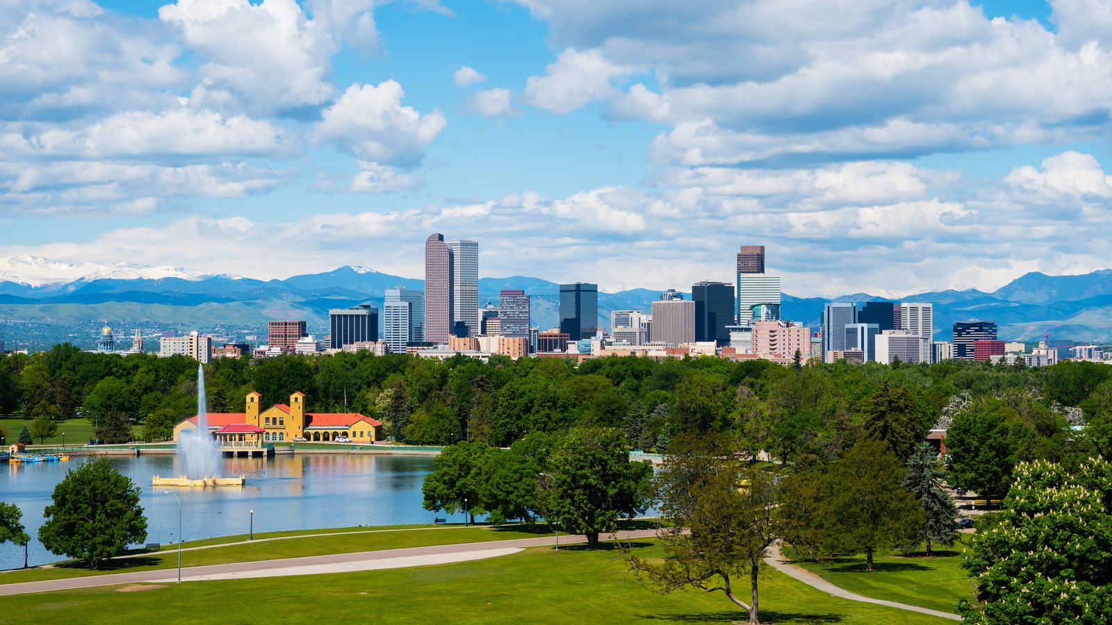 The Denver, Colorado skyline with the Rocky Mountains behind it