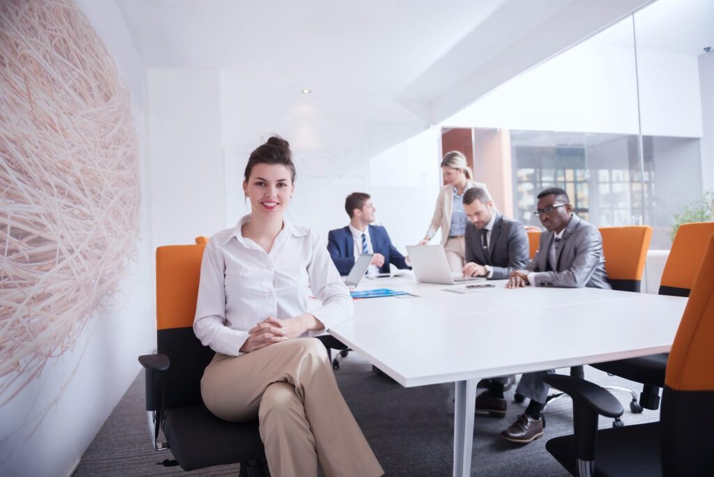 Colleagues in discussion around a conference room table