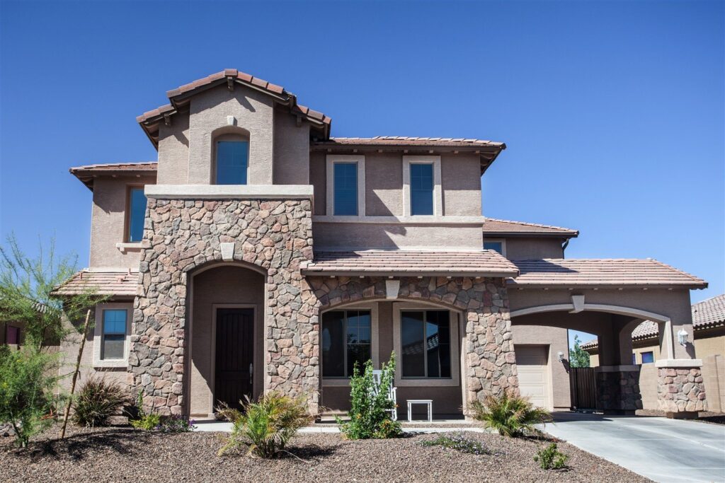 A two-storey stone and stucco home in a southwestern neighborhood