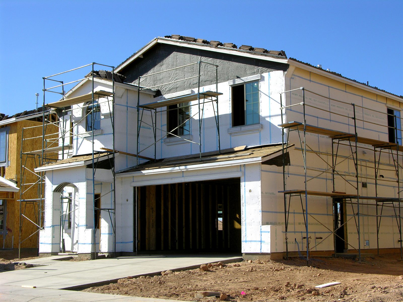 New home under construction with timber framing
