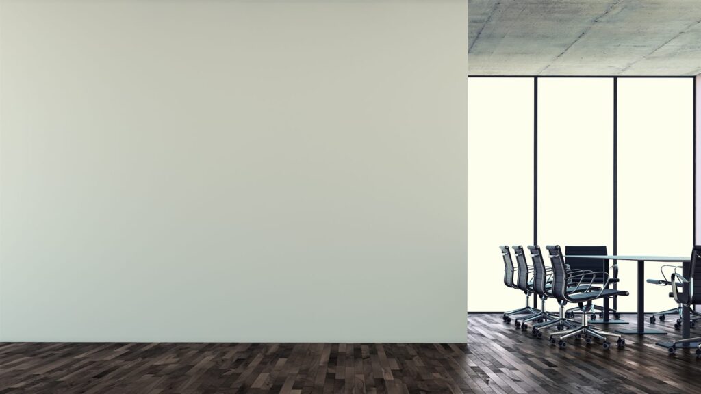 An empty conference room with a long table