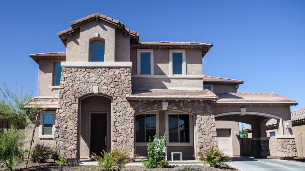 A stone-and-stucco family home in a Southwestern neighborhood