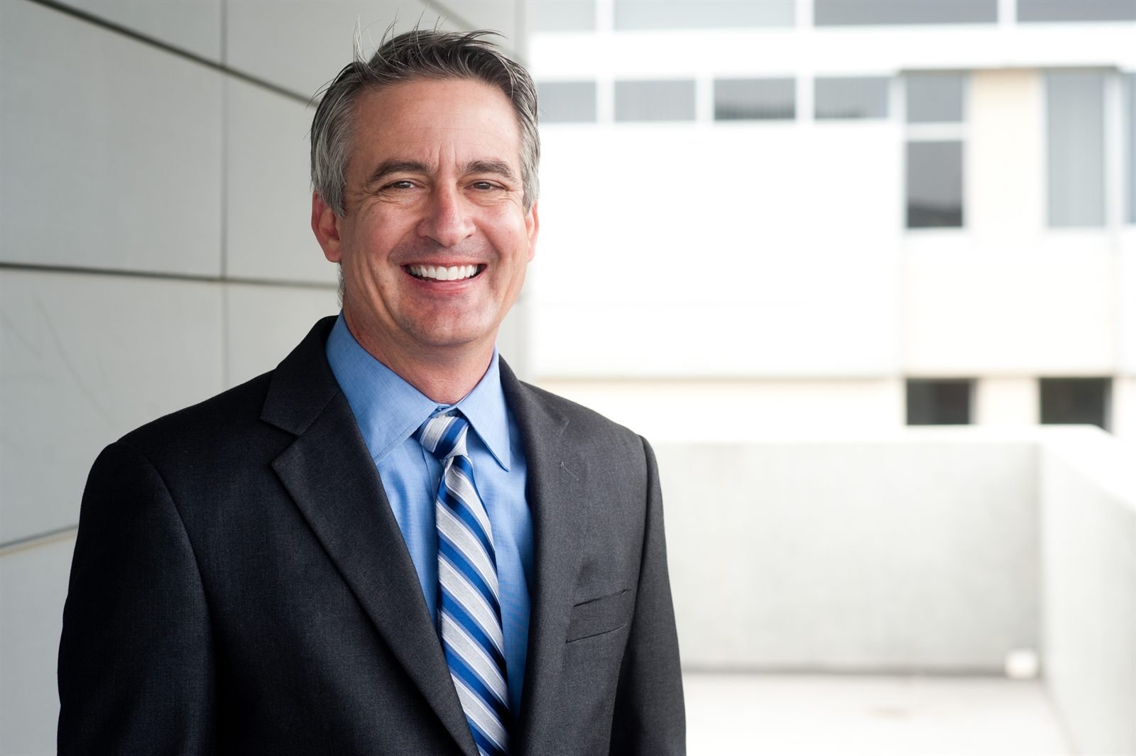 Professional man in a suit outside an office building