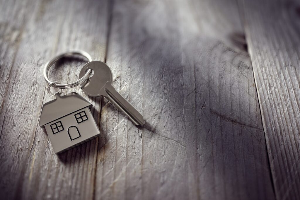 House key on a house shaped keyring