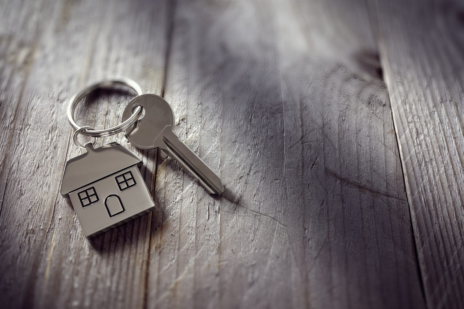 House key on a house shaped keyring