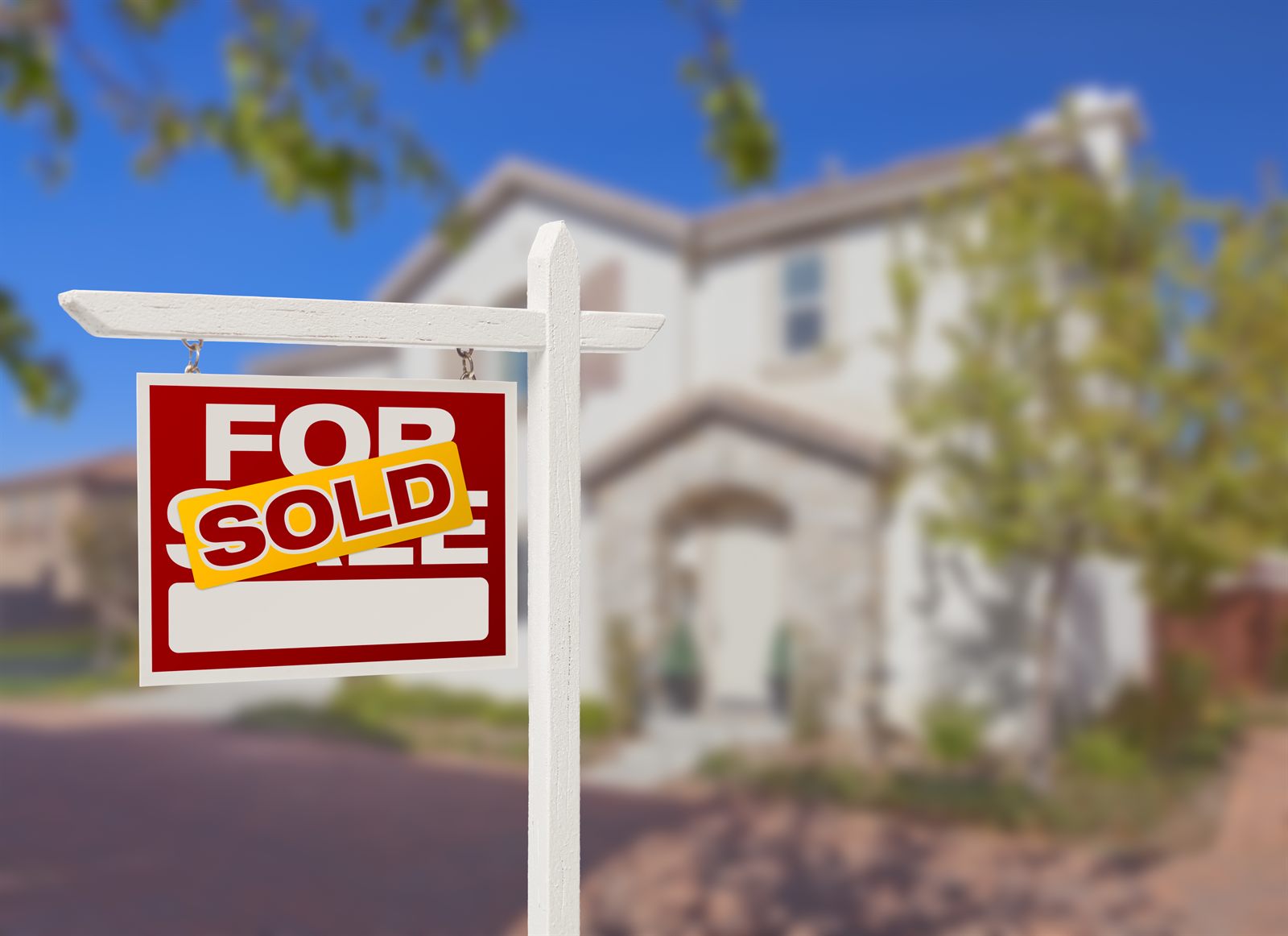 Sold sign in front of a home for sale
