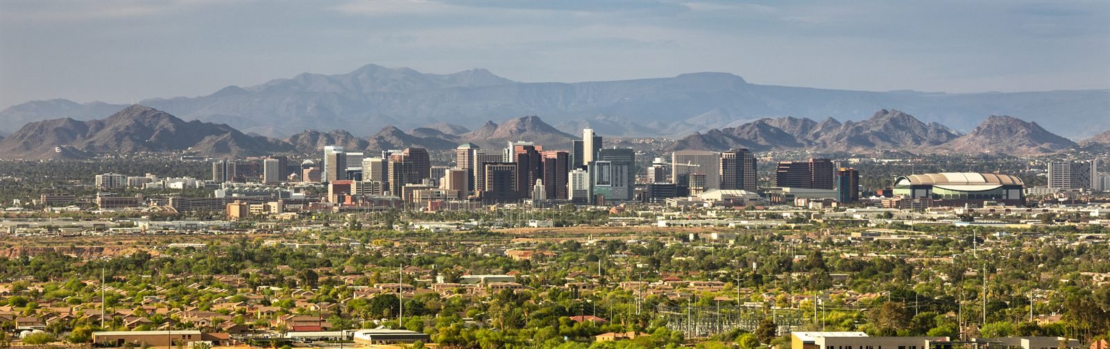 Panoramic view of the Phoenix skyline with mountains behind