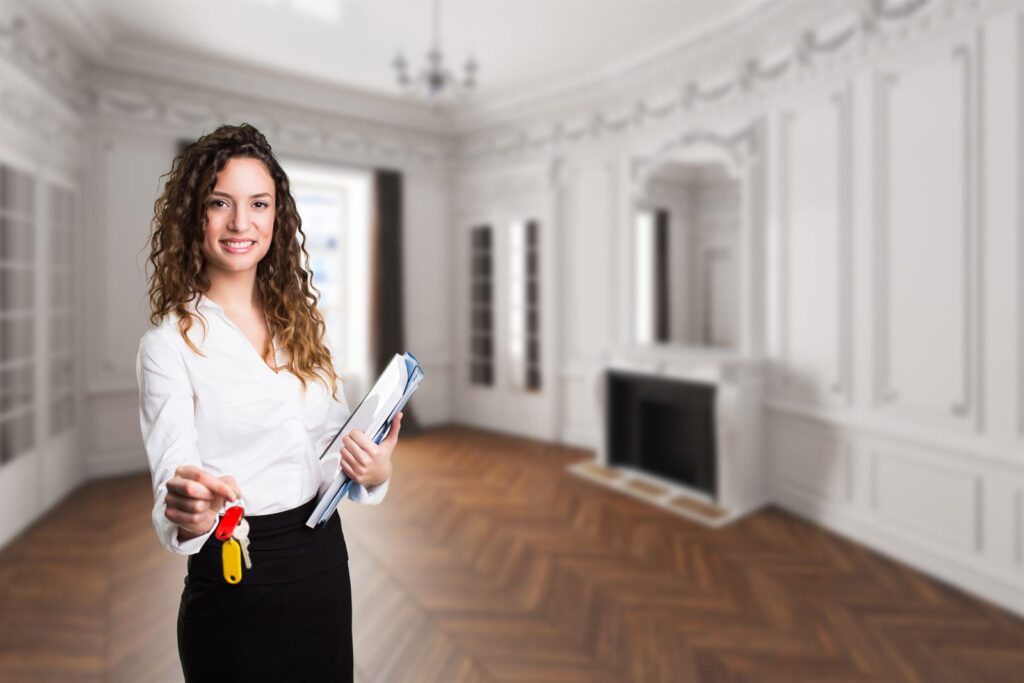 A professional with a clipboard inspecting an empty room