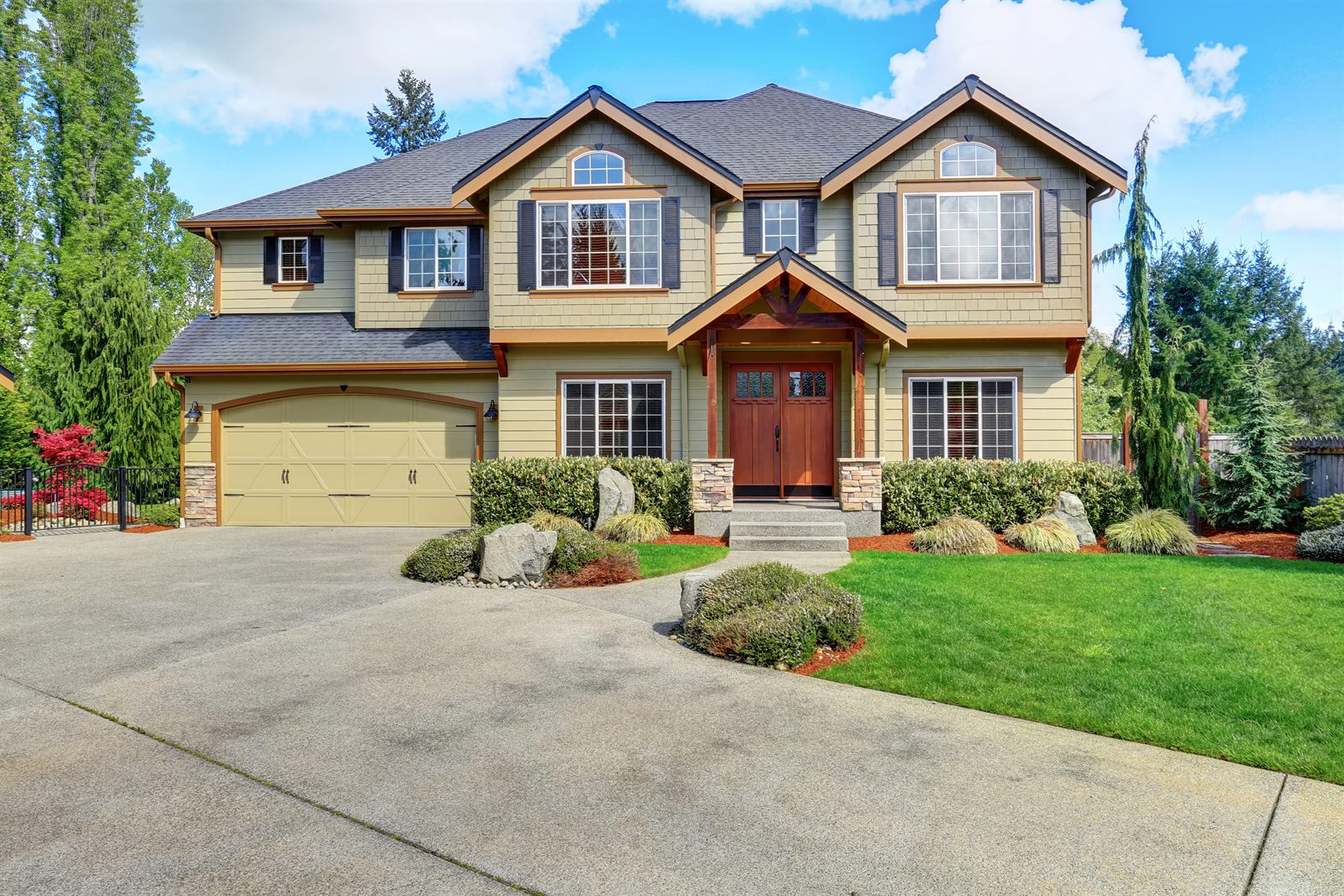 Large luxury home with a long driveway