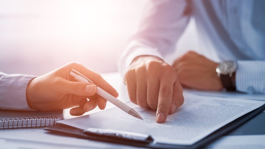 A borrower signing mortgage pre-approval documents