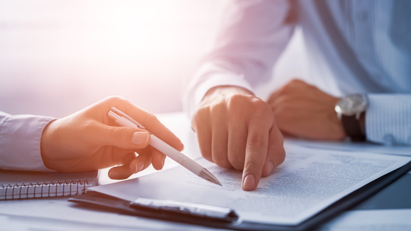 A borrower signing mortgage pre-approval documents