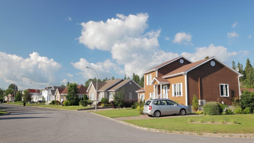 A quiet Midwestern residential street lined with family homes