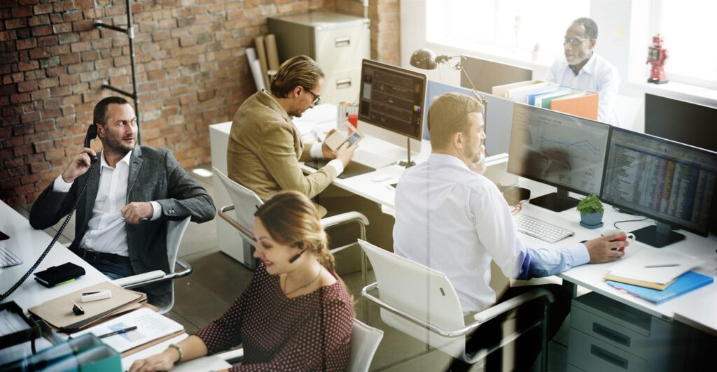 People working at desks in an open-plan office