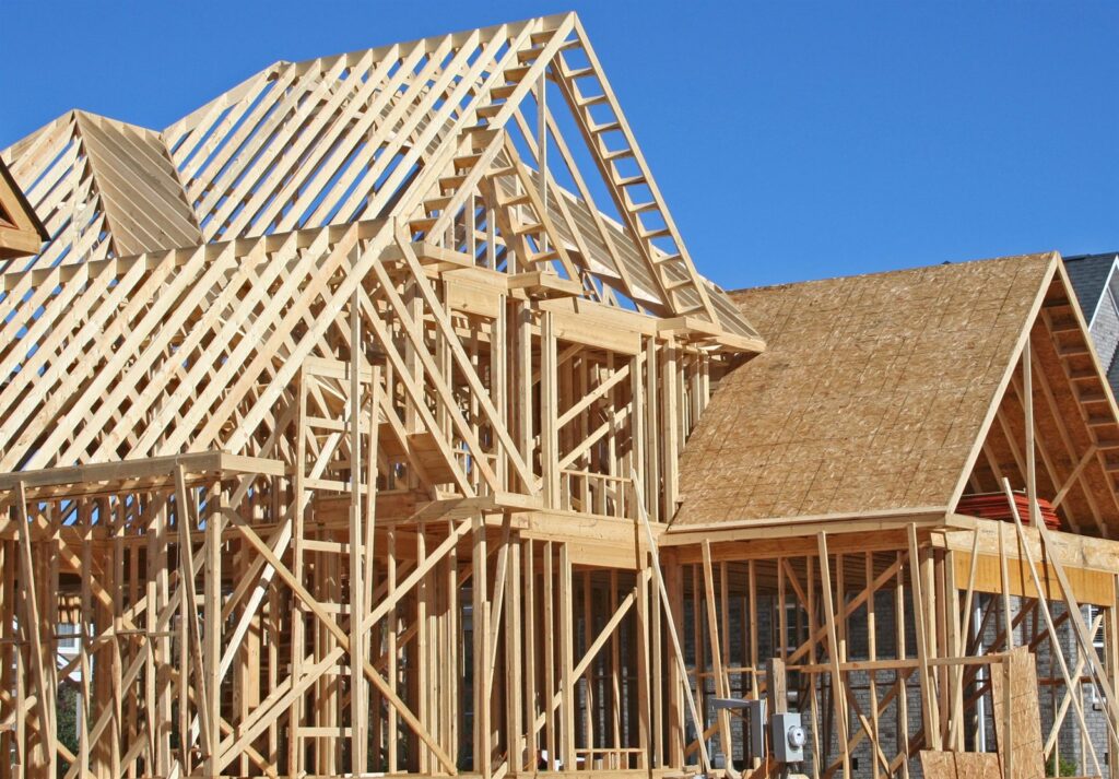 A house under construction with exposed framing