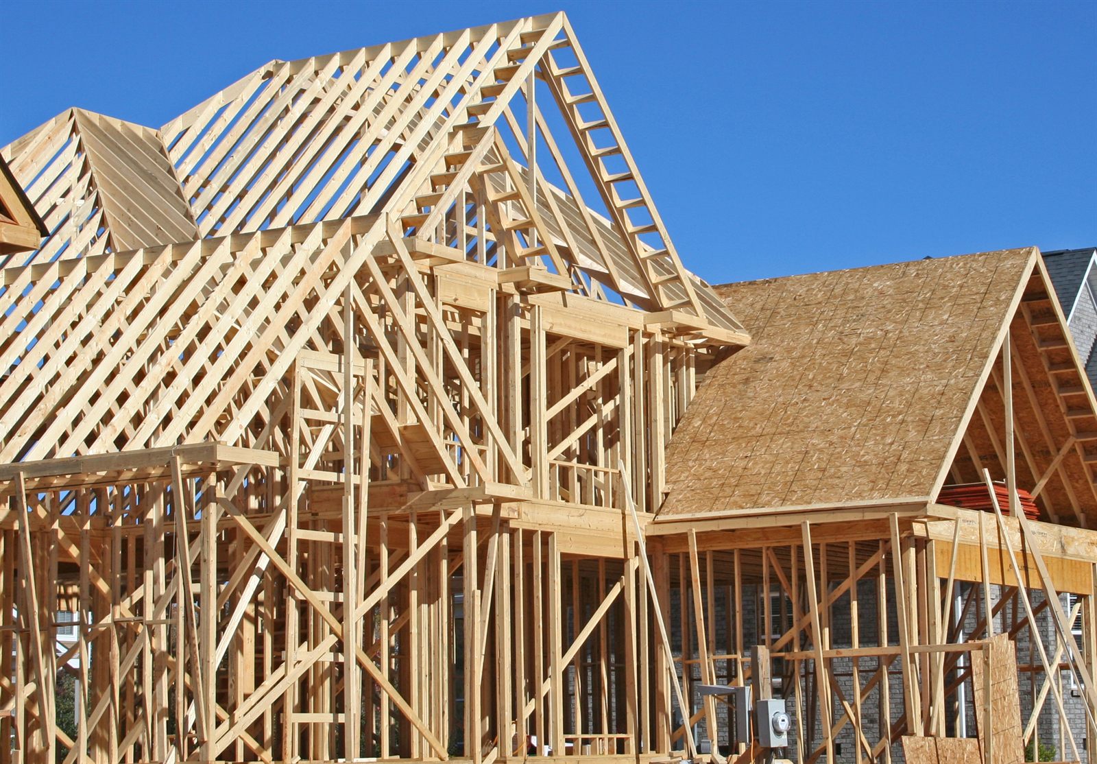 A house under construction with exposed framing