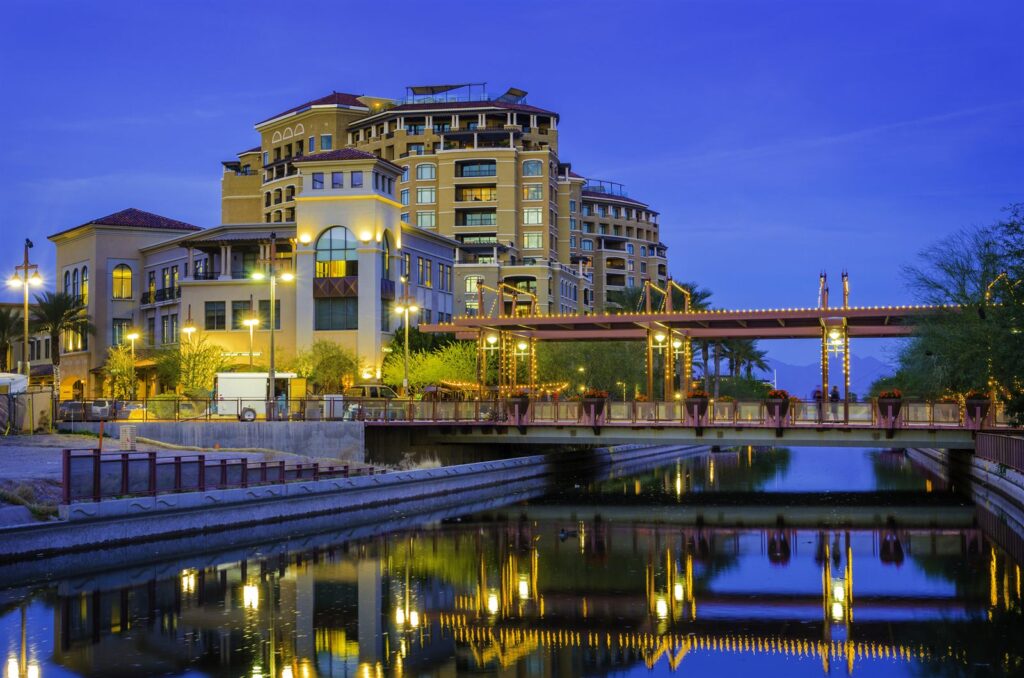 The canal in downtown Scottsdale, Arizona reflecting buildings at dusk