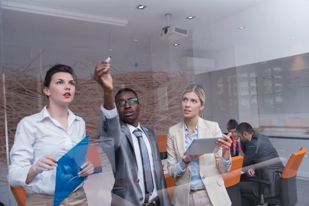 A team meeting in a glass-walled office