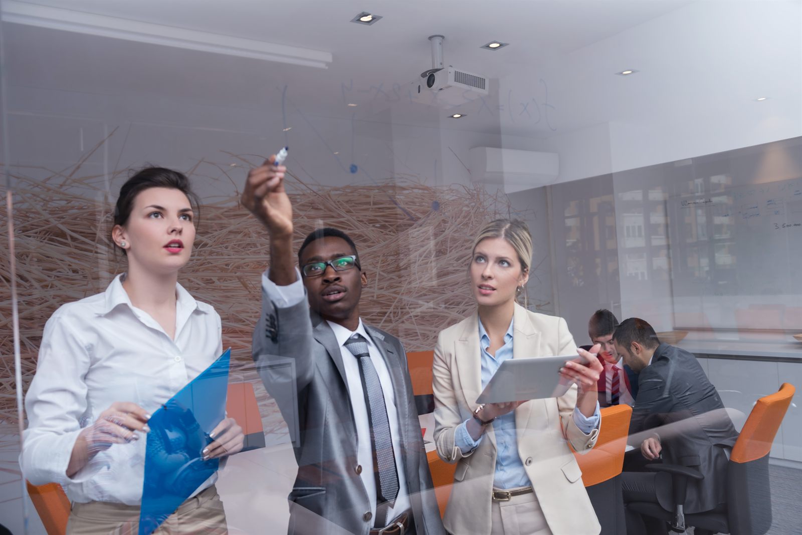 A team meeting in a glass-walled office
