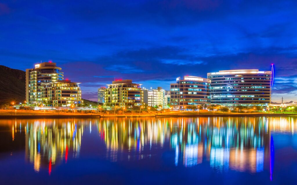 The Tempe, Arizona downtown skyline reflected in Tempe Town Lake at dusk