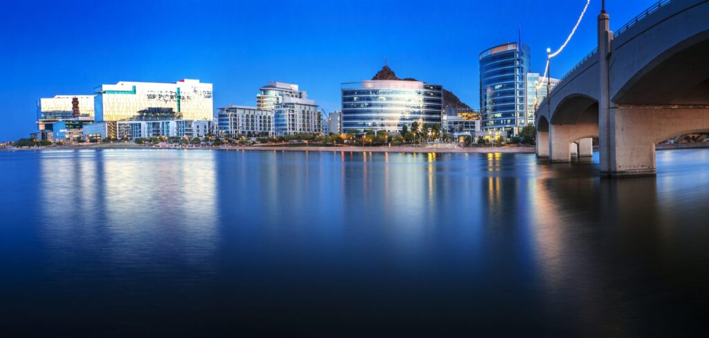 The Tempe waterfront and bridge lit at night